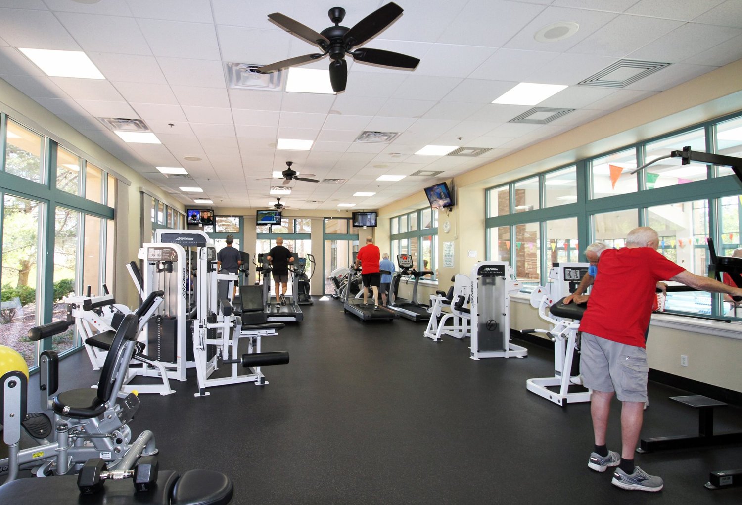 Residents working out in the fitness center
